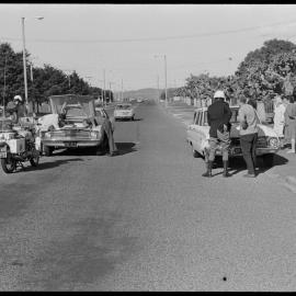 Traffic officers attending a minor traffic accident on unidentified road.