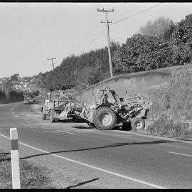Ministry of Works cutting back a bank on a corner of State Highway 2.