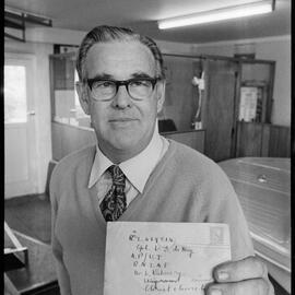 Mr D. E. De Mey of Tauranga taking delivery of a letter posted to him in 1943.