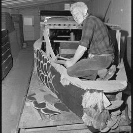 Mr Des Smith working on an Orange Festival float.