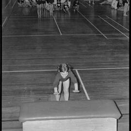Attempting a jump over the "horse" at a Western Bay gymnastics competition.