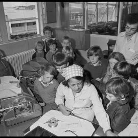 Pillans Point School students visiting Tauranga's Chief Post Office watch a telegram being prepared for delivery.