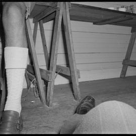 The leg of Mr Hermann Otto, helping the Tauranga Municipal Band prepare for a fundraising Bavarian stein evening, and the leg of the photographer in an accidental photograph