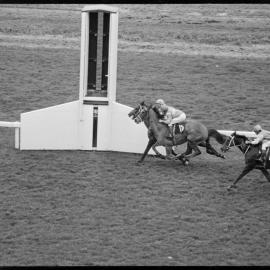 Horse racing. Crossing the finish line in an event at the Whakatane Racing Club's annual meeting at Tauranga.