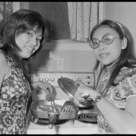 Singers for the Filipino Constellations showband cooking steak for their husbands.