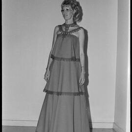 Feminine Focus. Unidentified dress and model at the annual Gown of the Year Show in the Tauranga Racecourse lounge.