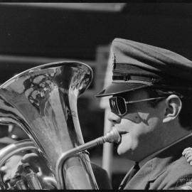 RNZAF Band member playing as it proceeds down Grey Street.