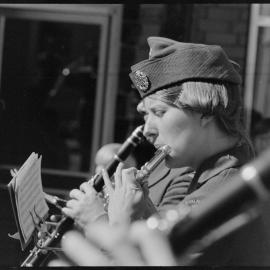 RNZAF Band member playing as it proceeds down Grey Street.