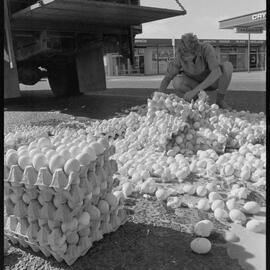 Truckload of eggs fall onto road