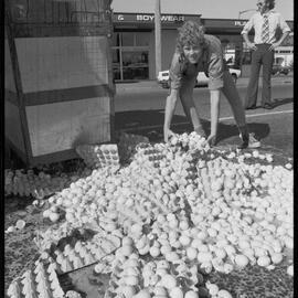 Truckload of eggs fall onto road