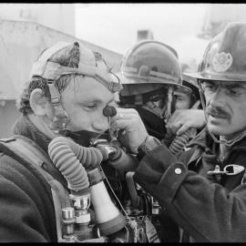 Firemen aboard the MV Star Castor
