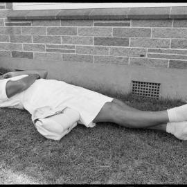 Lawn bowls player rests