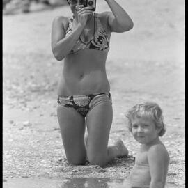 K. Brewer and son at beach