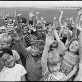 Children wave good-bye to Hot Air Balloon