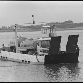 Milk tanker on barge from Matakana Island