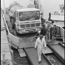 Milk tanker on barge from Matakana Island