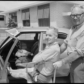 Mr C. H. Sanson and J. L. Harrison-Smith - wheelchair
