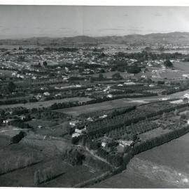 1963 - Oblique aerial of Ōtūmoetai citrus orchards, Whites Aviation stamp