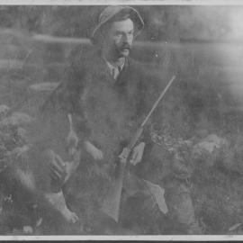 Hunter with dog and gun