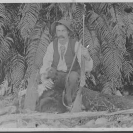 Hunter with dog and gun