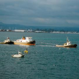 Historic Village Taioma tug being tugged