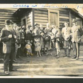 Men gathered with children