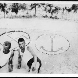 2 men with Nazi and anchor symbol to their rear