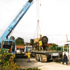 Historic Village locomotive lifted by McLeod crane c. late-1990s