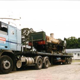 Historic Village locomotive on Owens Transport vehicle c. late-1990s