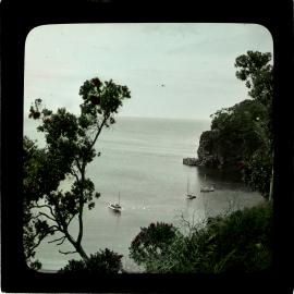 Coastal view with boats, bay and headland