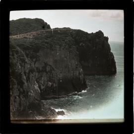 Coastal view with headland, bush and cliffs