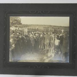 Crowd at a funeral 
(Caption: Crowd at a funeral)
