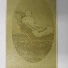 Unidentified baby in a pram 
(Caption: Unidentified child)