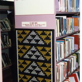 Kākahu covering a tukutuku panel waiting to be unveiled
