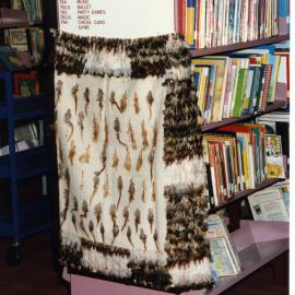 Kākahu covering a tukutuku panel waiting to be unveiled