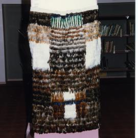 Kākahu covering a tukutuku panel waiting to be unveiled