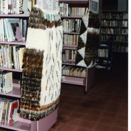 Kākahu covering a tukutuku panel waiting to be unveiled