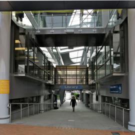 Photograph down the arcade between the Tauranga City Library and Council from Wharf Street