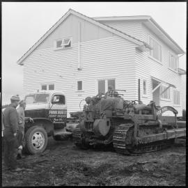 House removed from airport runway site. 