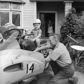 Malcom Dean, aged 2, on motorcycle, 1960