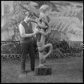 Jon Freeland with his carving Raurangi
