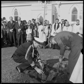 Rear Admiral J O'C Ross plants Kauri tree at St George's Church Gate Pā