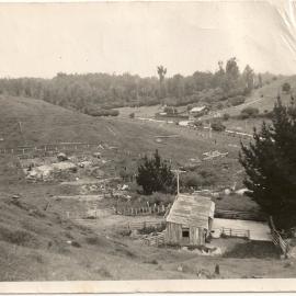 Looking down at the cowshed and piggeries and over to the neighbour’s house across the road.