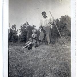 Allan, Vivian and Anthony on the haystack