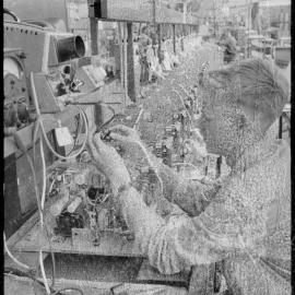 TISCO. A technician watching a dial while he winds on the coil for T.V. receiver
