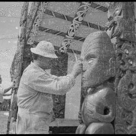 Mr Brown Rewiti restoring a carved figure at the Hairini Pā meeting house  