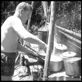 Boy Scouts. Reg Parry stirring the mince for lunch.