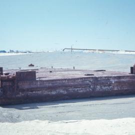 Old barge being buried