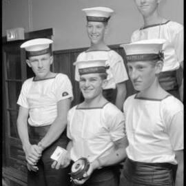 Petty Officer R. J. Howland with trophies