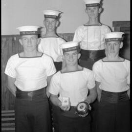Petty Officer R. J. Howland with trophies